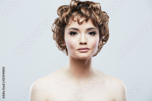 Young woman close up face beauty portrait.Short Hair style. Fema