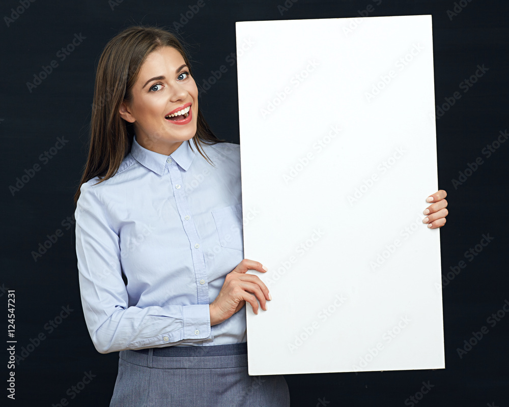 Happy emotional business woman holding white sign board studio p Happy emotional business woman holding white sign board studio p
