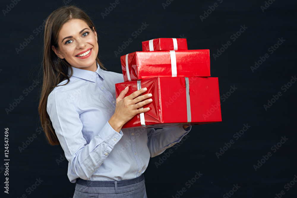 Happy smiling business woman holding red gift boxes Happy smiling business woman holding red gift boxes