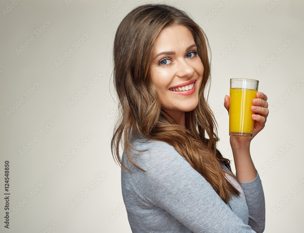 woman holding glass with orange juice smiling with teeth. woman holding glass with orange juice smiling with teeth.