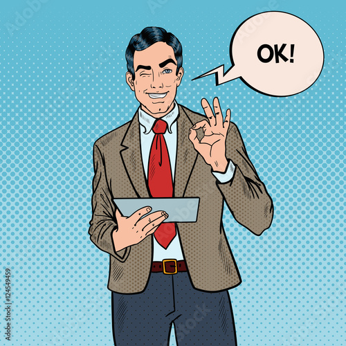 Pop Art Businessman with Tablet Gesturing OK and Winking. Vector illustration