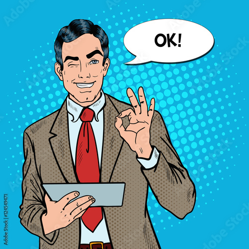 Pop Art Businessman with Tablet Gesturing OK and Winking. Vector illustration