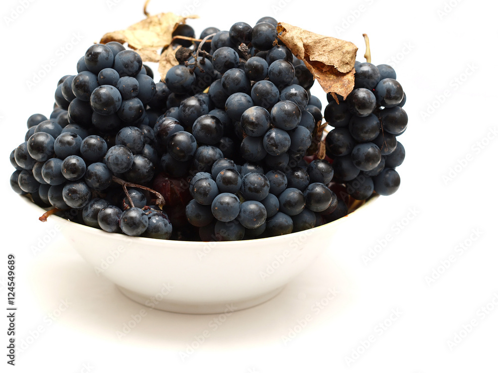 plate with grapes on a white background plate with grapes on a white background