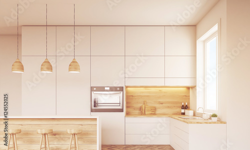 Sunlit kitchen with oven and window