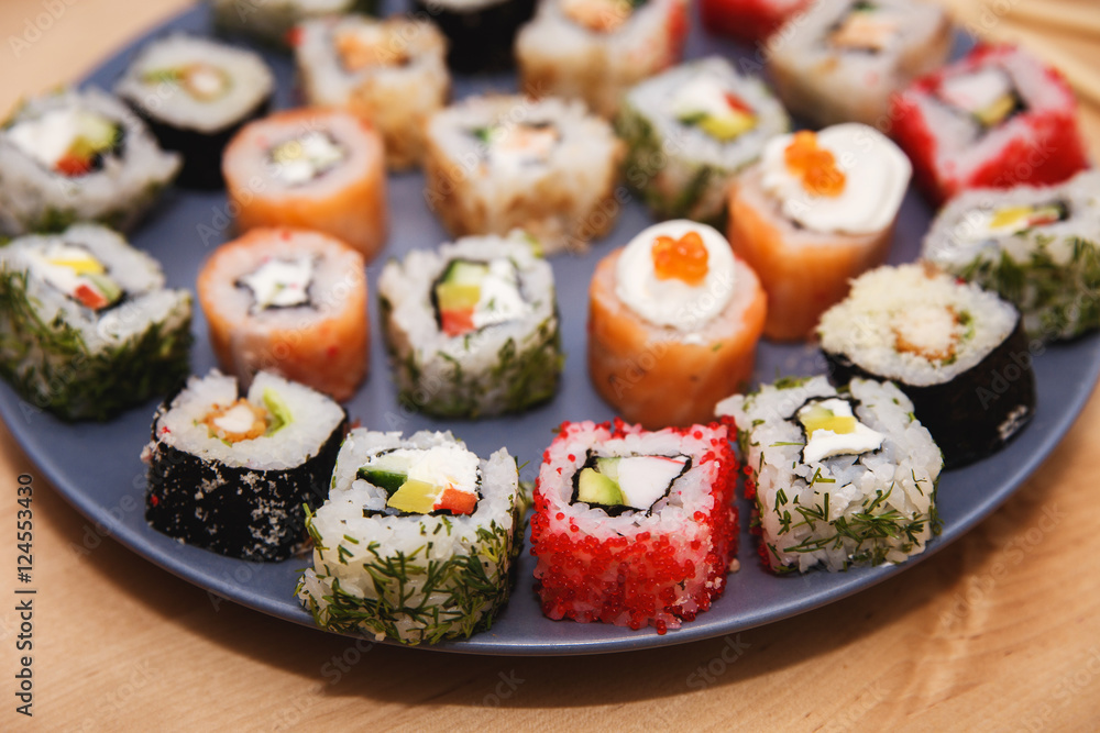 Sushi set on a blue plate Sushi set on a blue plate