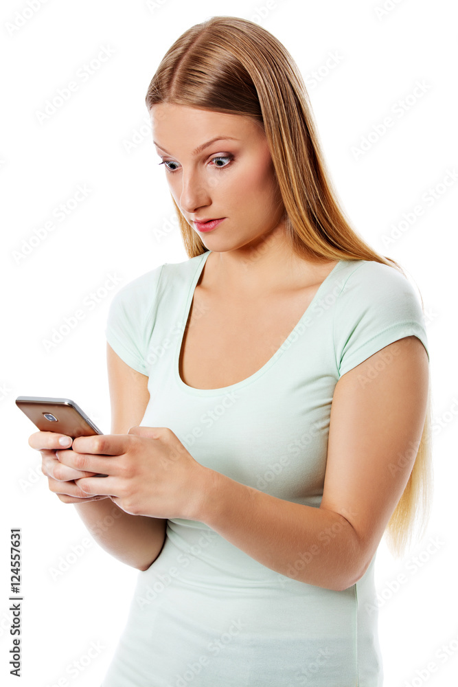Woman sending a sms on cell phone, isolated on white. Woman sending a sms on cell phone, isolated on white.