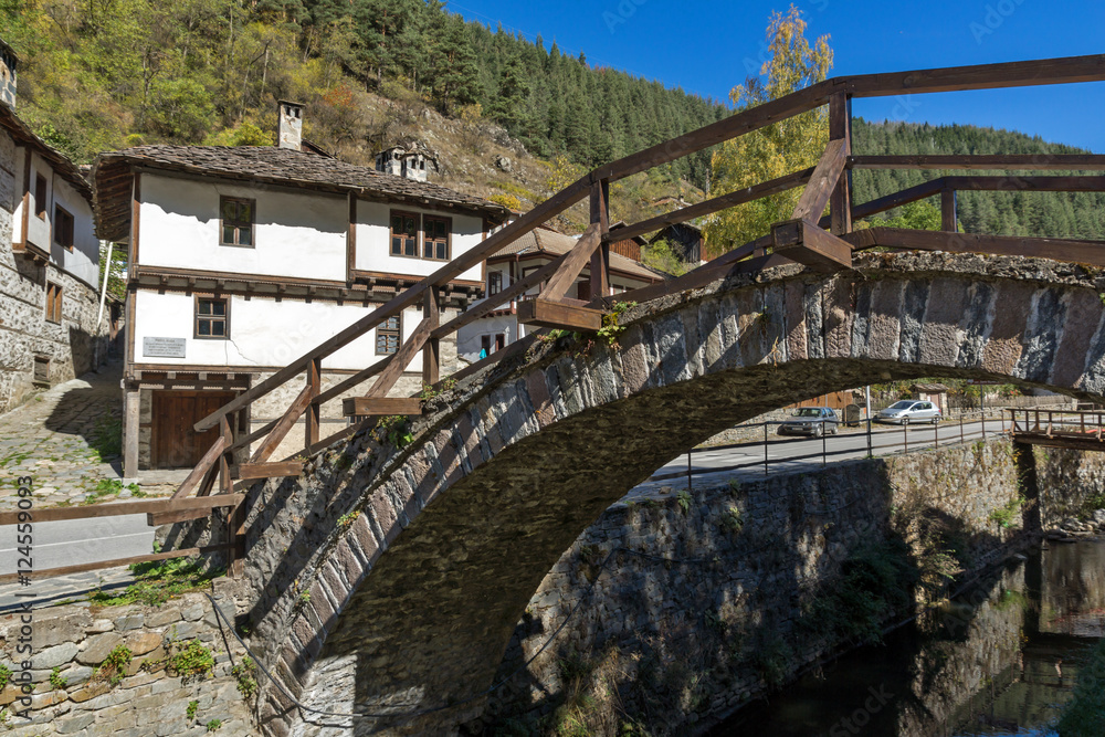 Autumn Landscape with Roman Bridge and old houses in town of Shiroka Laka, Smolyan Region, Bulgaria Autumn Landscape with Roman Bridge and old houses in town of Shiroka Laka, Smolyan Region, Bulgaria