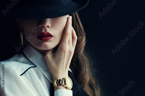 Indoor portrait of a young beautiful  fashionable woman wearing stylish acces...