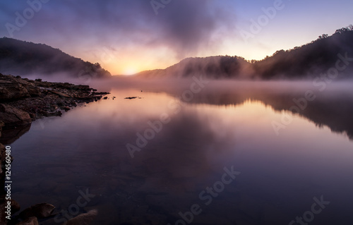morning sunrise on foggy lake © jdross75