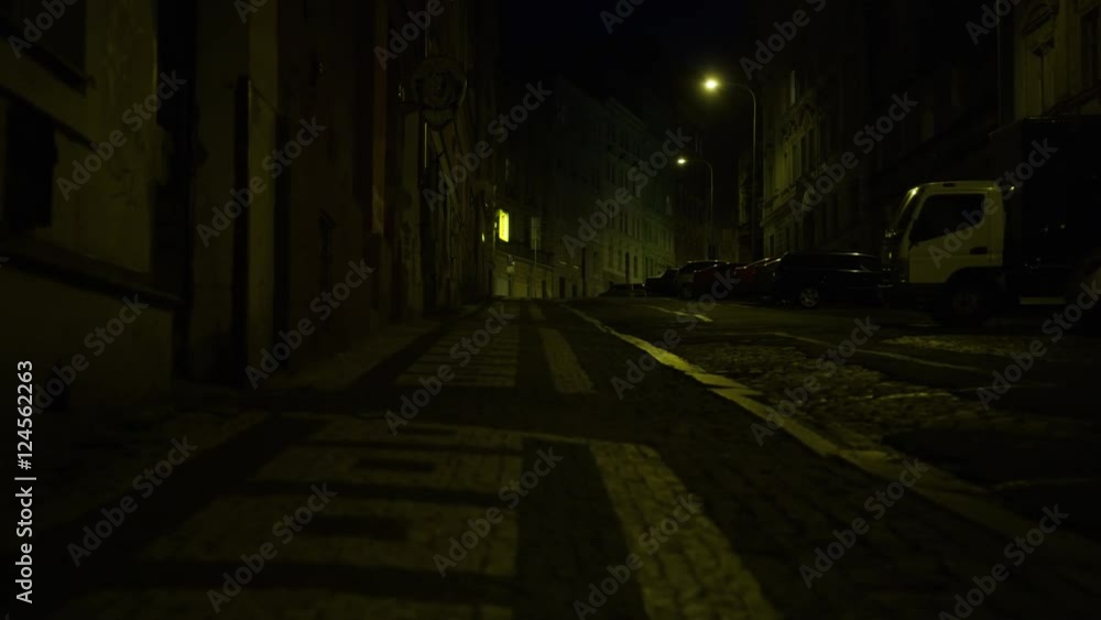 Walking along a street in Prague at night. Czech sign for 'Convenience Store' at corner. Low angle. 4k. Walking along a street in Prague at night. Czech sign for 'Convenience Store' at corner. Low angle. 4k.