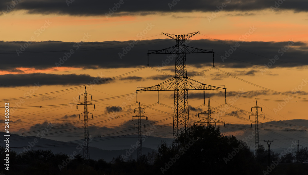 Electric poles after autumn sunset