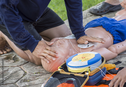 Obraz na płótnie CPR and AED training child dummy drowning case