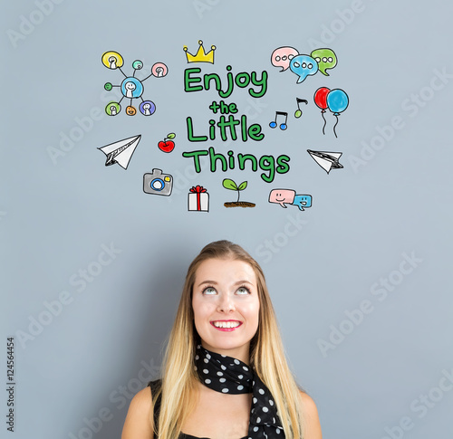 Enjoy The Little Things concept with happy young woman