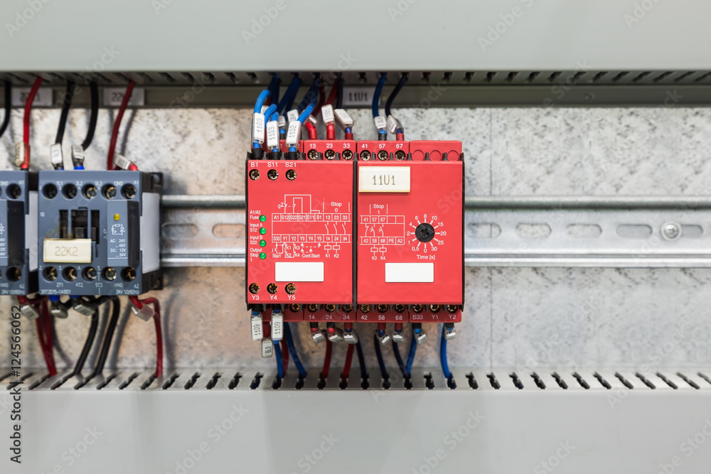 Safety relay for emergency stop monitoring Stock Photo Adobe Stock