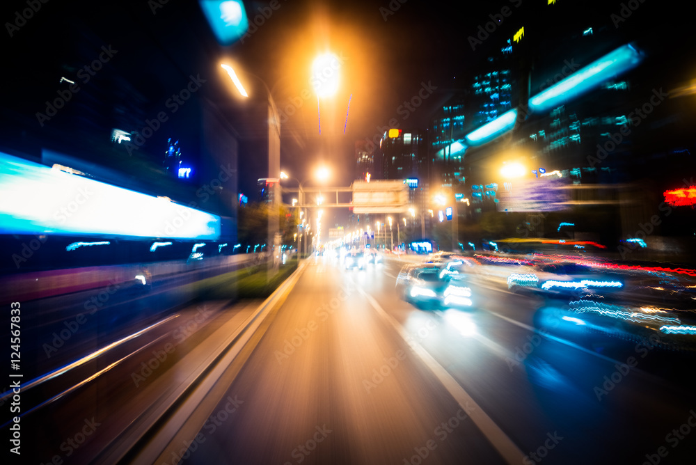 blurred traffic light trails on road at night in China. blurred traffic light trails on road at night in China.