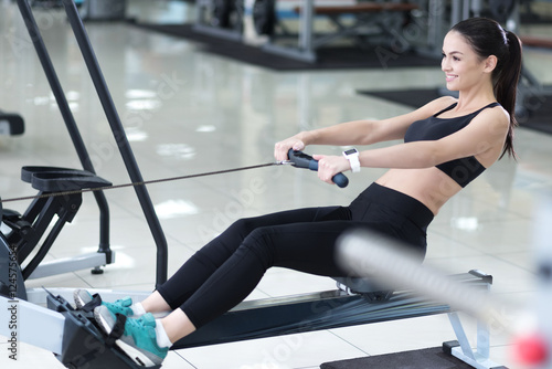 Happy woman spending time in a gym