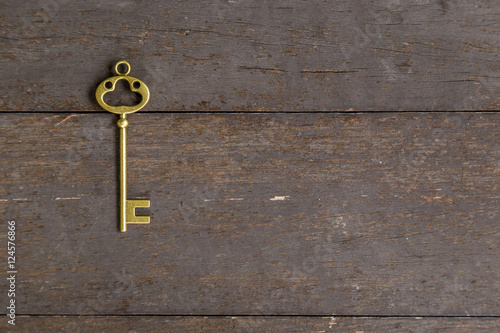 old key vintage on wooden background with space