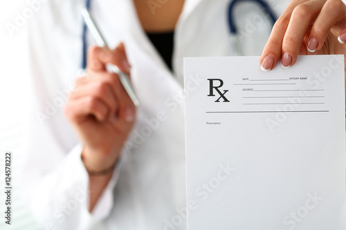 Female medicine doctor hand give prescription to patient