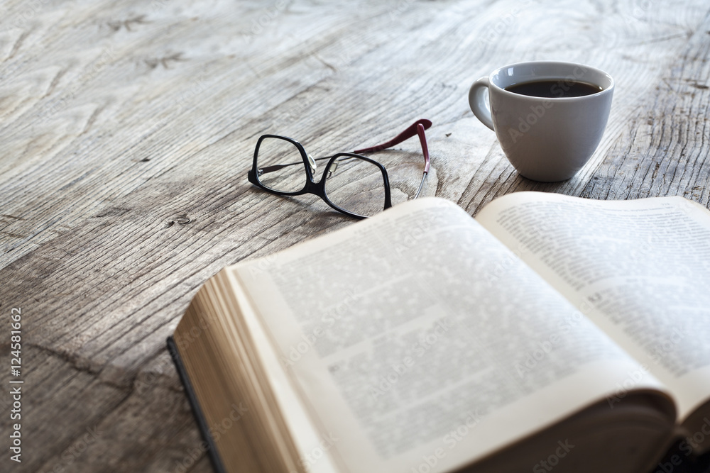 Fototapeta premium Reading book with coffee on table