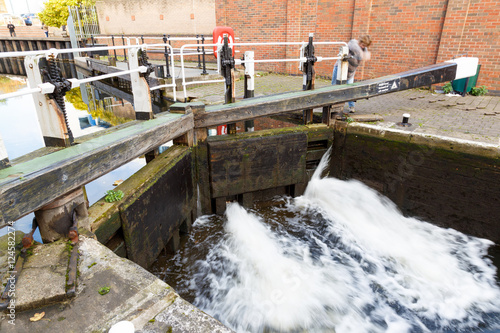 Woman operating a pound lock at Nottingham Canal.