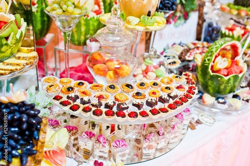Wedding reception. Table with fruits and sweets