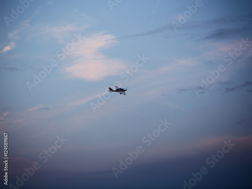 Small aeroplane flies in sky © Volodymyr