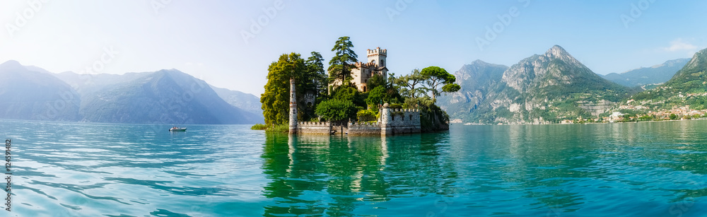 View of Loreto island in Italy and the hills in the background on a sunny day.