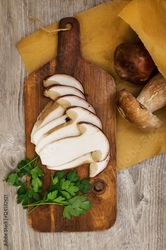 fresh boletus slices over cutting board