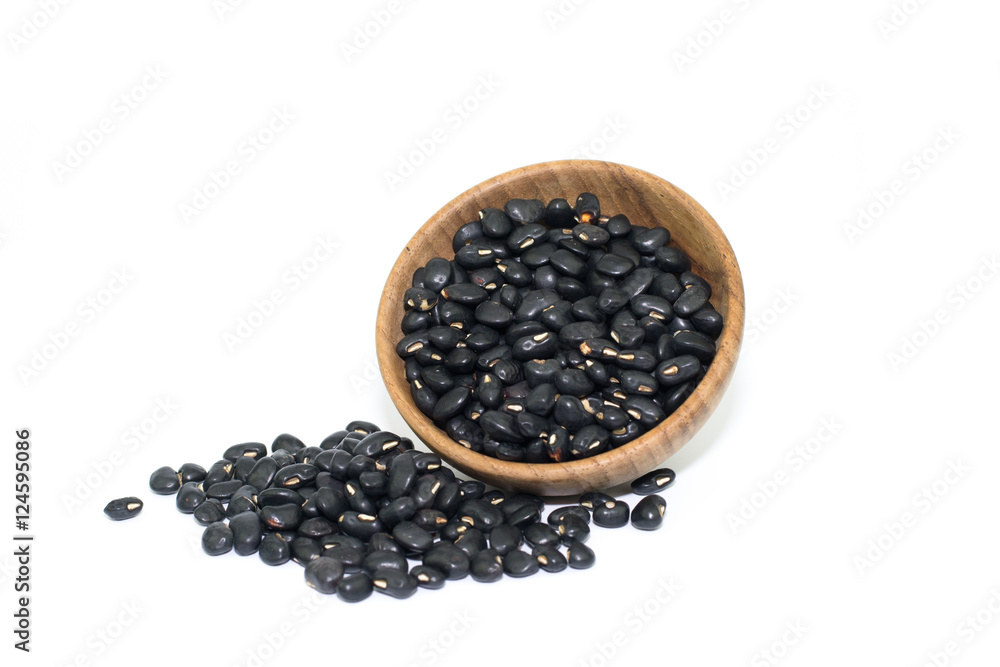 Wooden bowl of dry black beans on white Wooden bowl of dry black beans on white