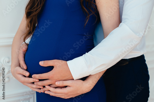 pregnant woman with her husband, her husband's and wife