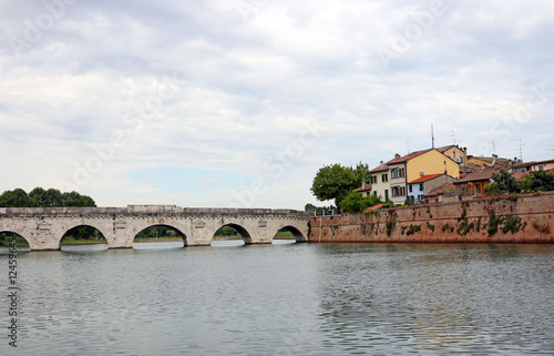 Tiberius bridge and old houses Rimini Italy