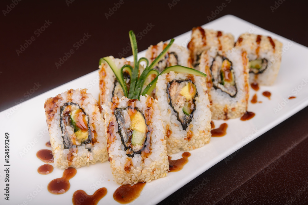 Sushi rolls on a white plate