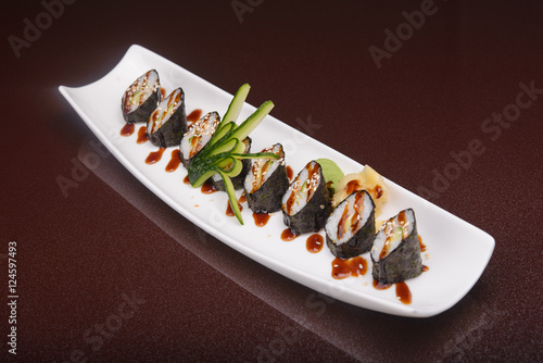 Sushi rolls on a white plate