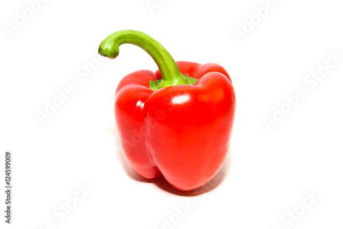 The fruit of red paprika pepper on white