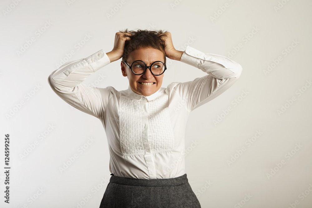 Frustrated female teacher in conservative clothes Frustrated female teacher in conservative clothes