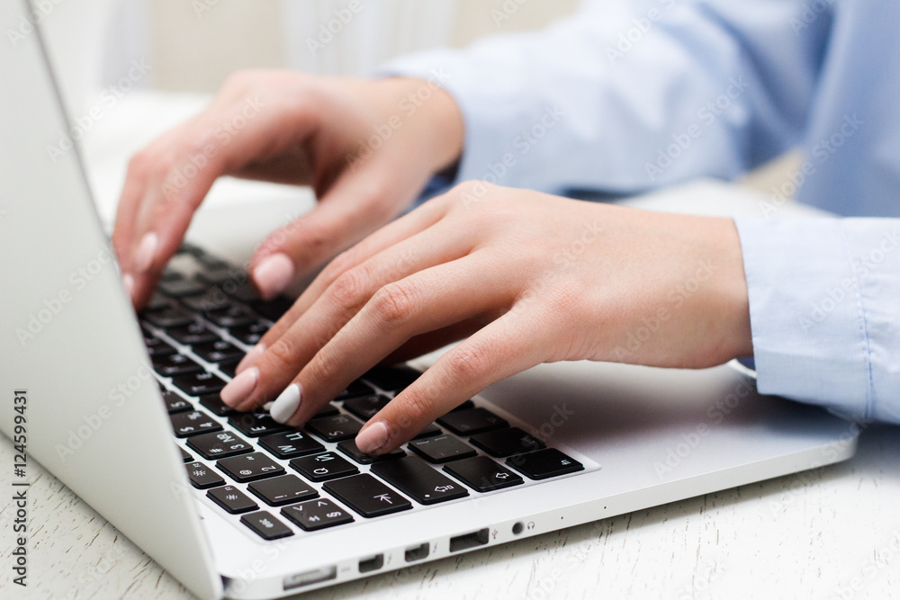 Human hands working on laptop on office background, business Human hands working on laptop on office background, business