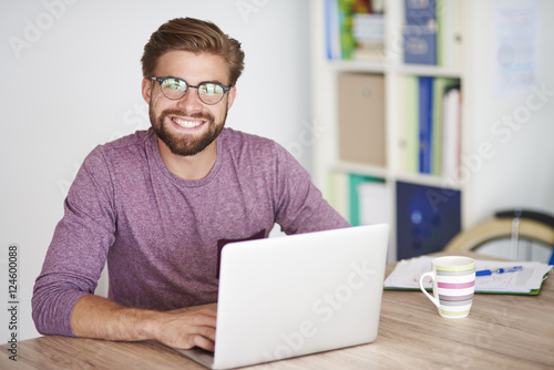 Portrait of man in front of the laptop