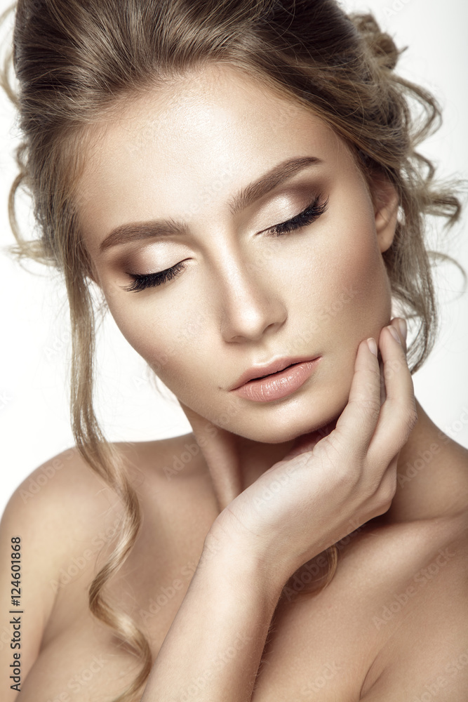 Beautiful woman portrait with nude make up on white background. Beautiful woman portrait with nude make up on white background.