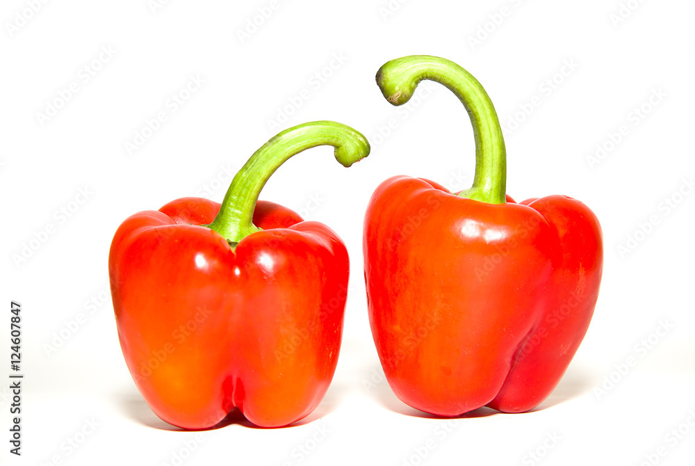 The fruits of red paprika pepper on white The fruits of red paprika pepper on white