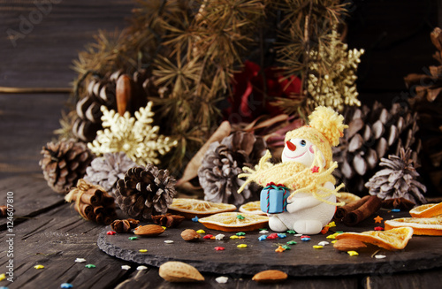 figurine Snowman on Christmas BACKGROUND , selective focus