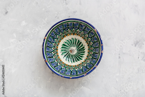 traditional central asian bowl on concrete plate