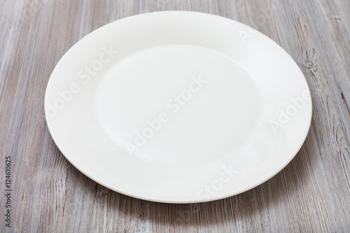 white plate on gray brown table