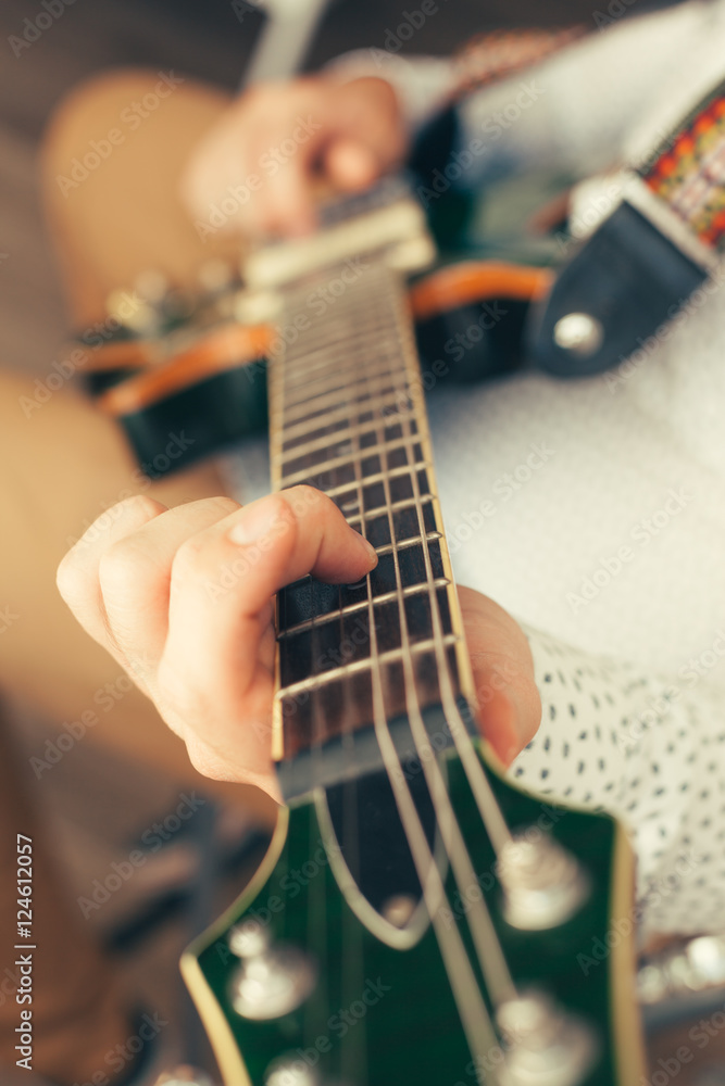 man playing electric guitar