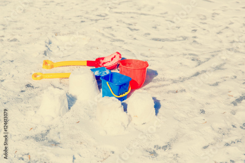 Kids toys in winter snow