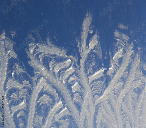 Ice flowers at window. Winter. Frost. photo