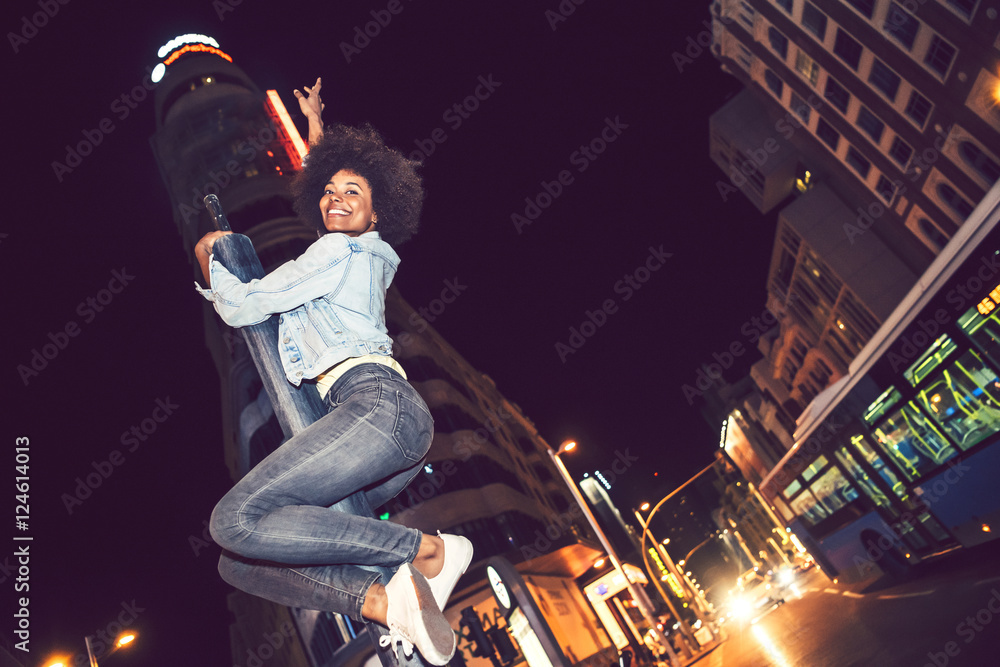 Beautiful black woman perched on a pole partying Beautiful black woman perched on a pole partying