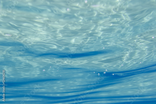 Blue underwater surface and ripples, natural scene in the ionian sea
