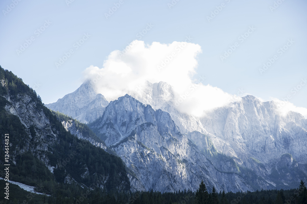 Mountains covered with white clouds under blue sky from Planica