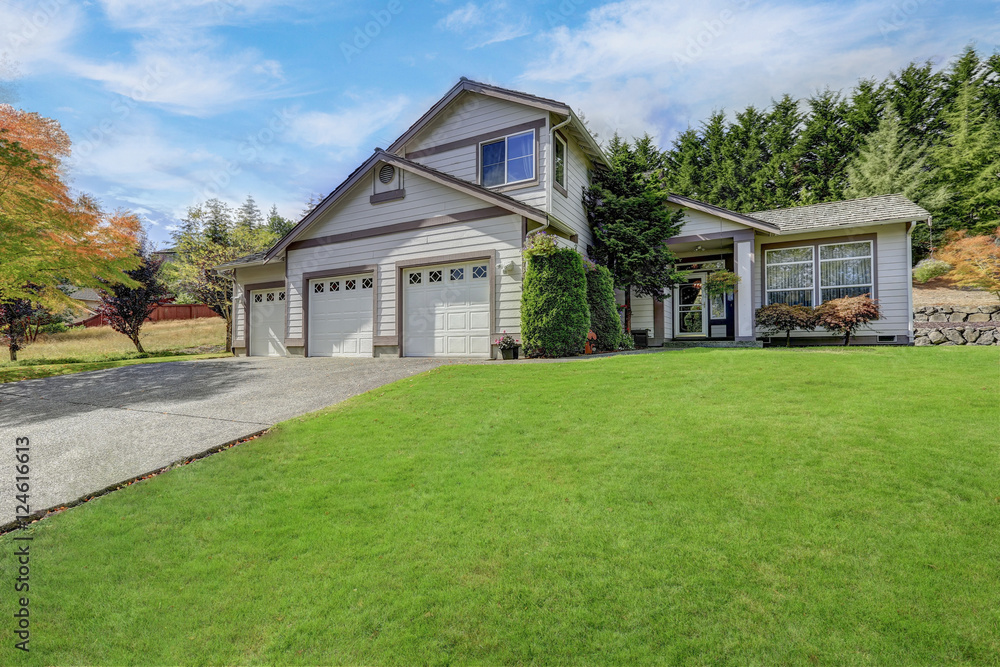 Luxury house exterior with three garage spaces