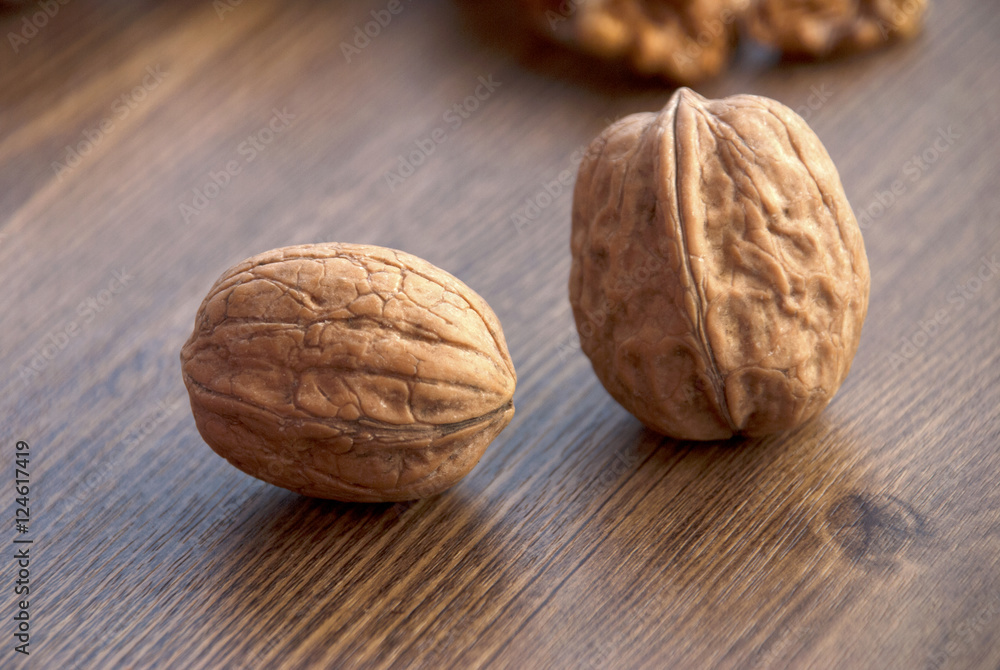 walnuts on the wooden-table. walnuts on the wooden-table.